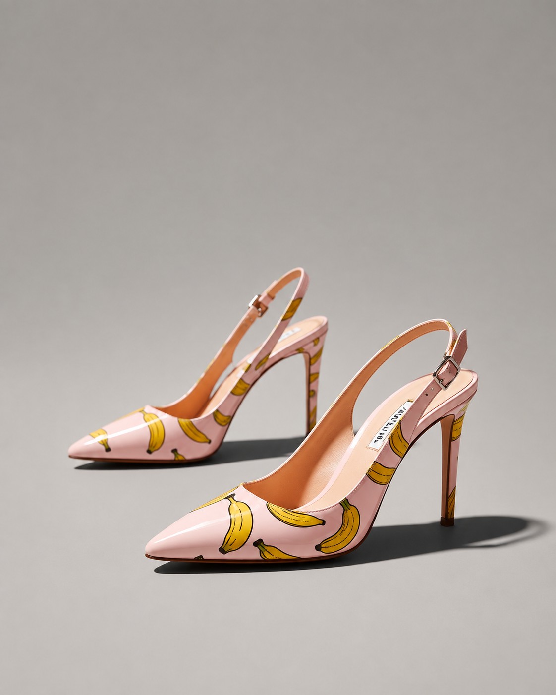 Playful pink slingback pump with a hand-drawn print, a lighter capsule piece
